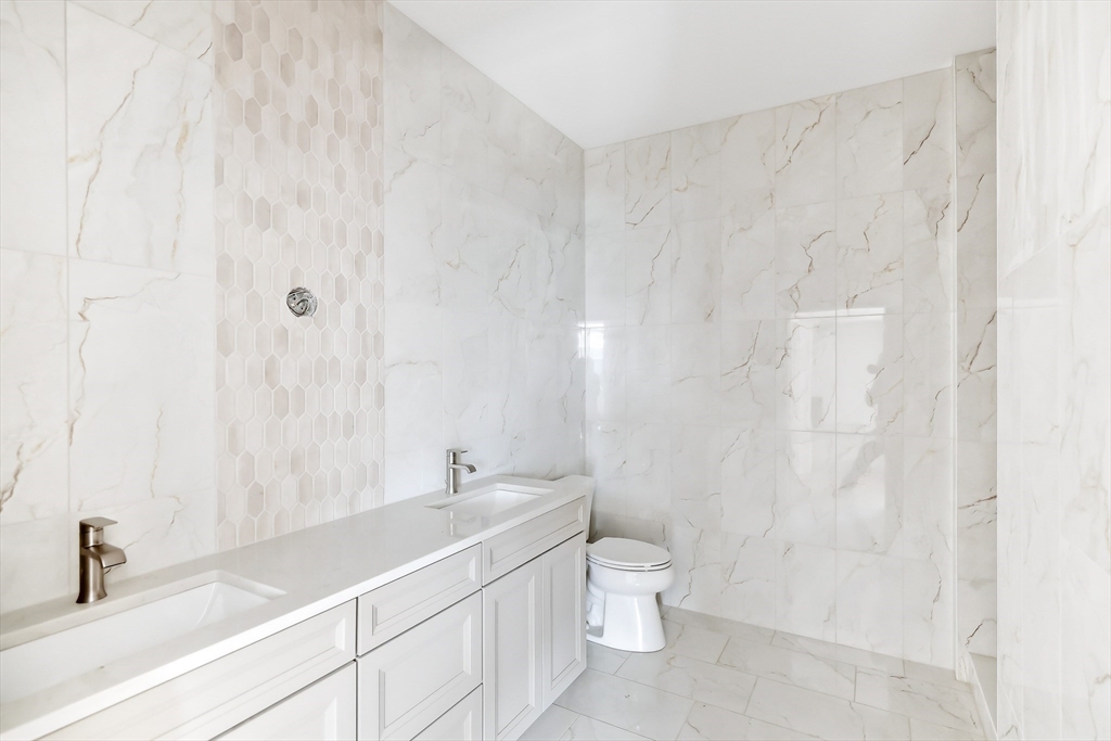 7 Elizabeth Lane, Unit 7 Paxton, MA 01612 - Photo 16 of 30 a bathroom with a granite countertop sink a toilet and a bathtub