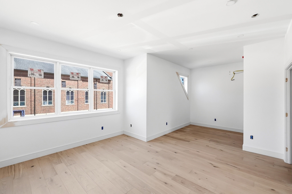7 Elizabeth Lane, Unit 7 Paxton, MA 01612 - Photo 19 of 30 a view of an empty room with wooden floor and windows