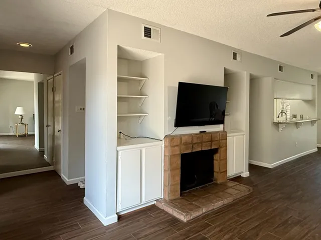 a view of a livingroom with furniture and a flat screen tv