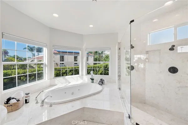 a view of a chairs and table in the balcony