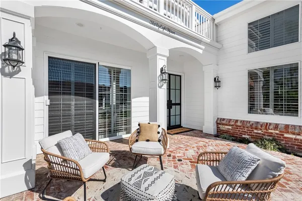 a balcony with furniture and window
