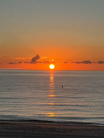 a view of balcony and yard