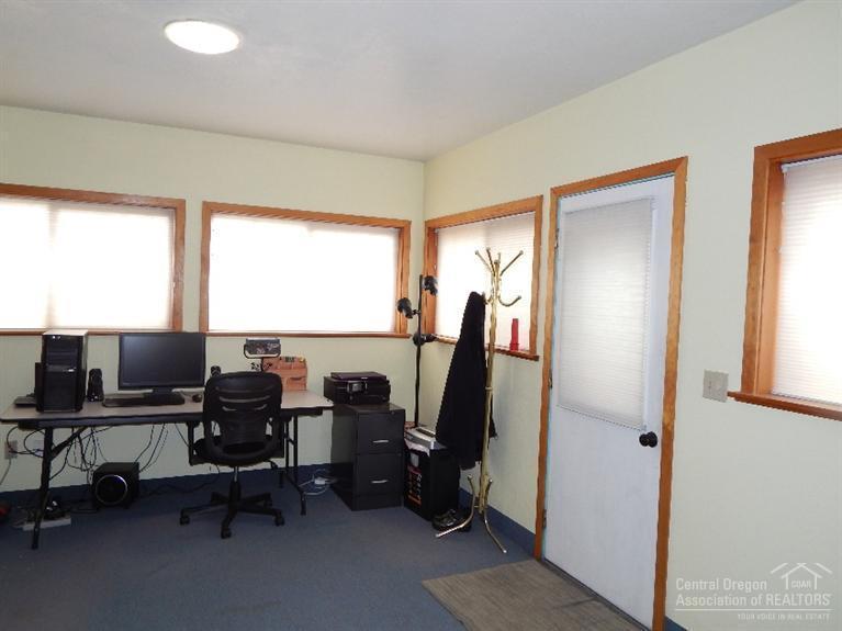 63511 Vogt Road Bend, OR 97701 - Photo 19 of 21 a view of a workspace with furniture and a window