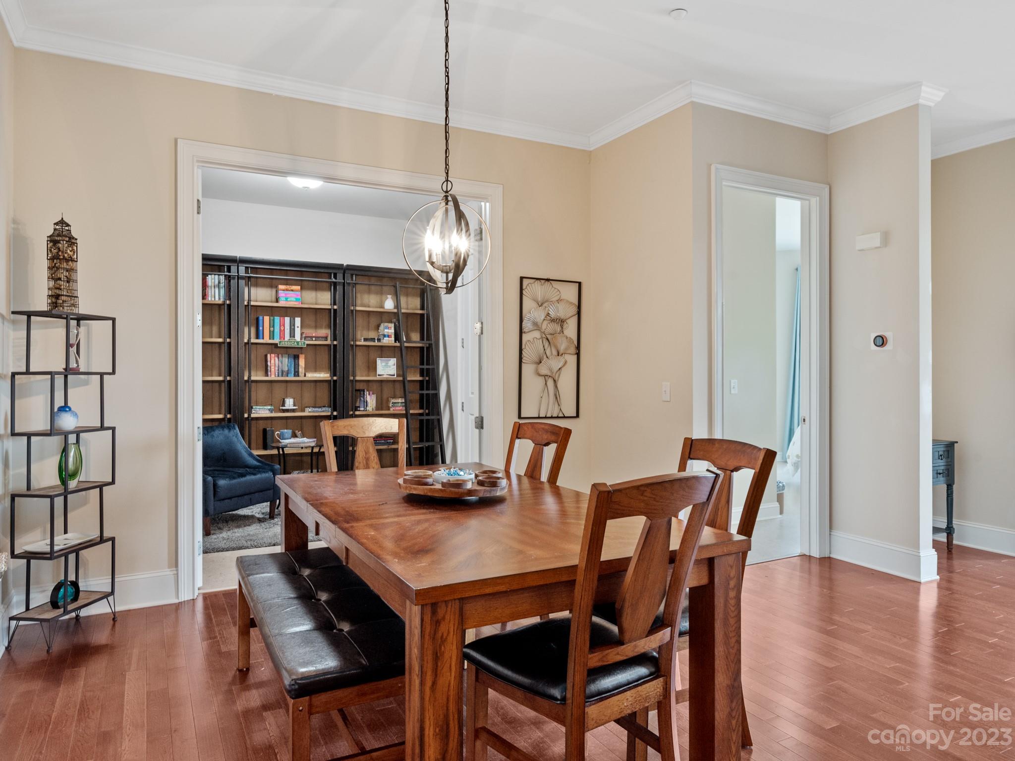 5425 Closeburn Road, Unit 201 Charlotte, NC 28210 - Photo 14 of 35 a view of a dining room with furniture and wooden floor
