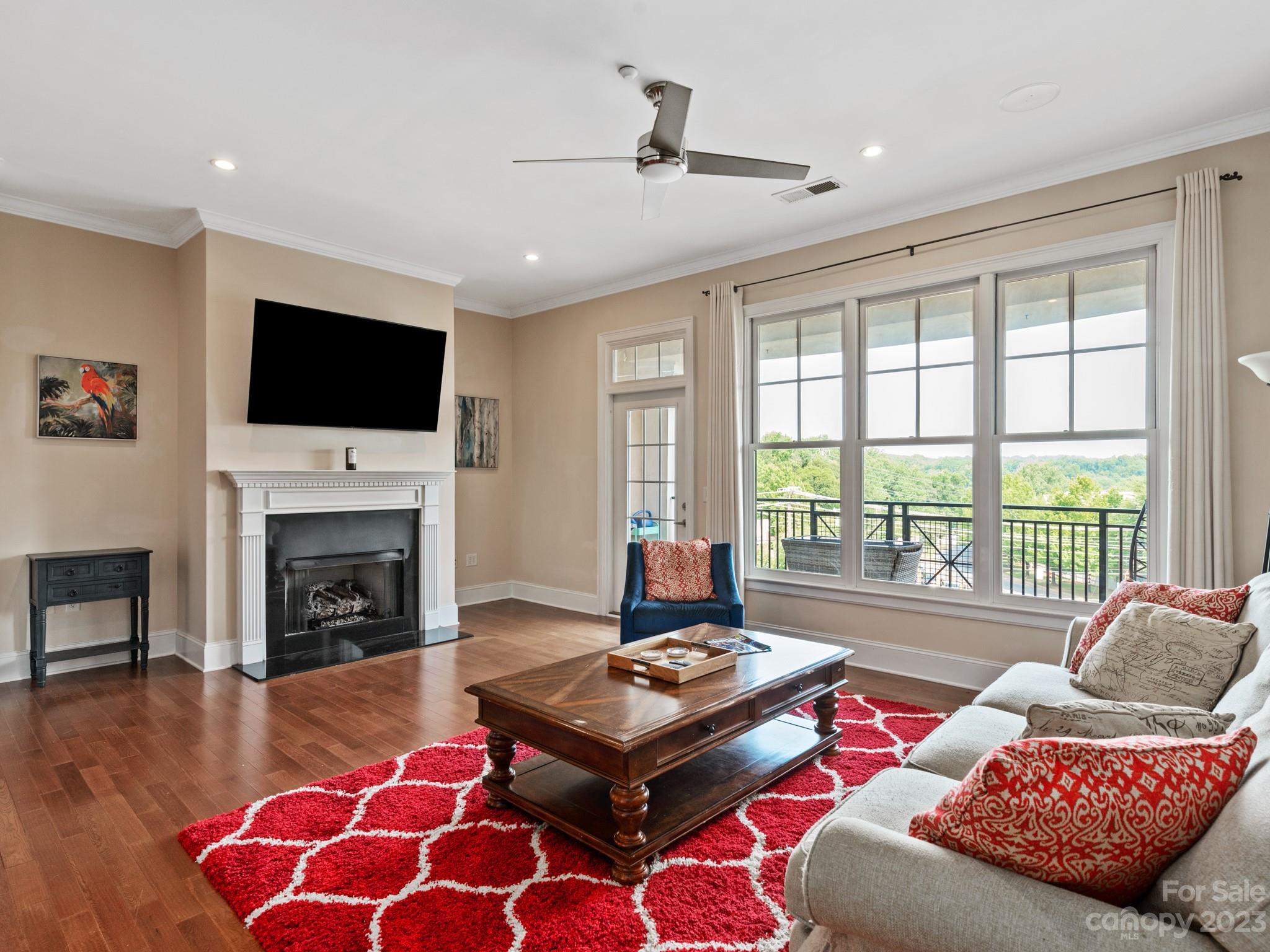 5425 Closeburn Road, Unit 201 Charlotte, NC 28210 - Photo 19 of 35 a living room with furniture fireplace and flat screen tv