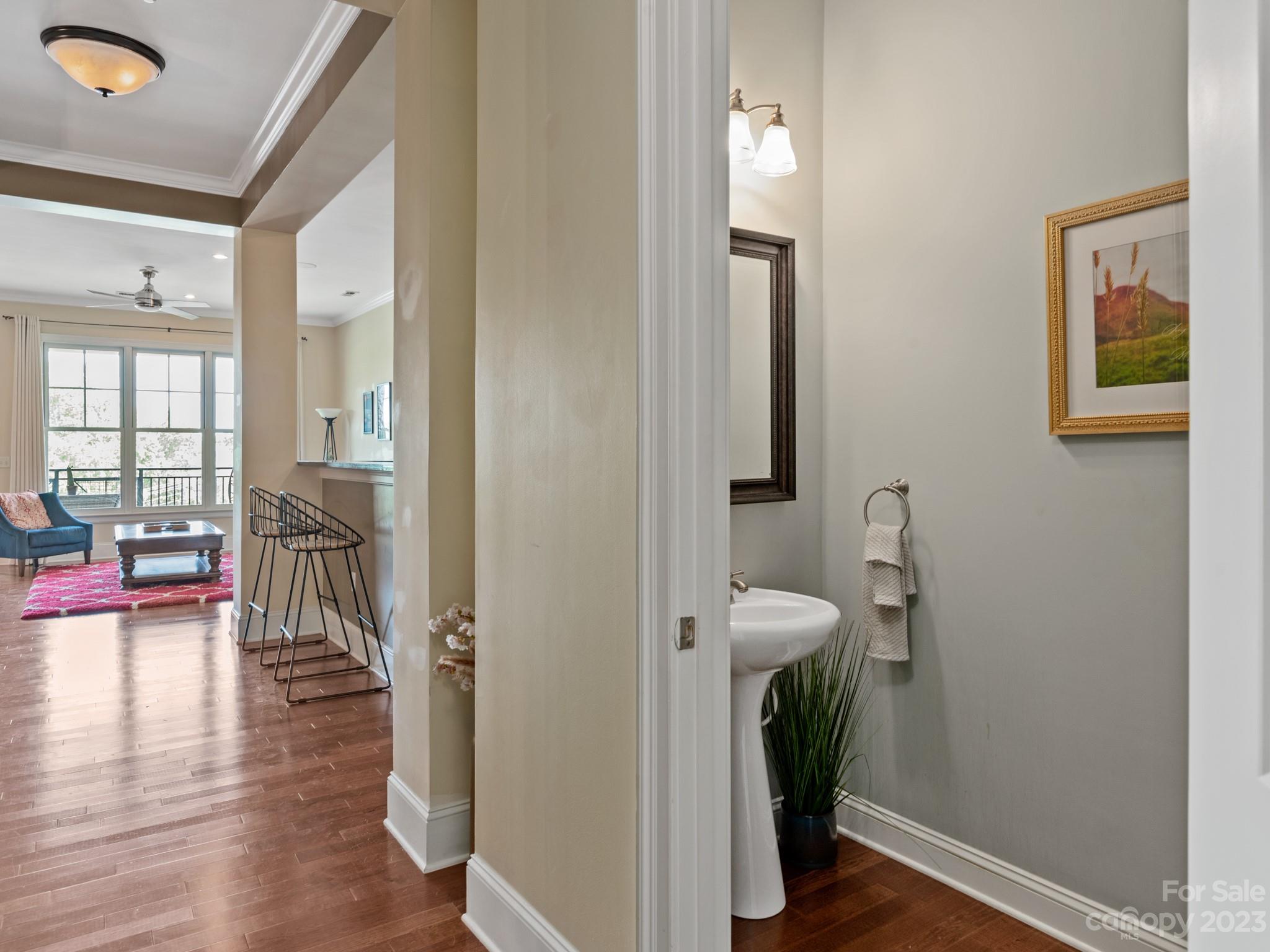 5425 Closeburn Road, Unit 201 Charlotte, NC 28210 - Photo 24 of 35 a view of a hallway with furniture and wooden floor