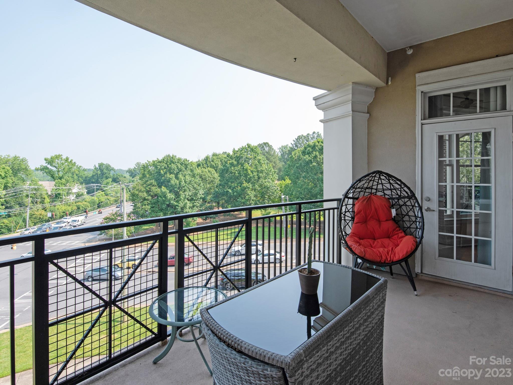 5425 Closeburn Road, Unit 201 Charlotte, NC 28210 - Photo 29 of 35 a view of a two chairs in the roof deck