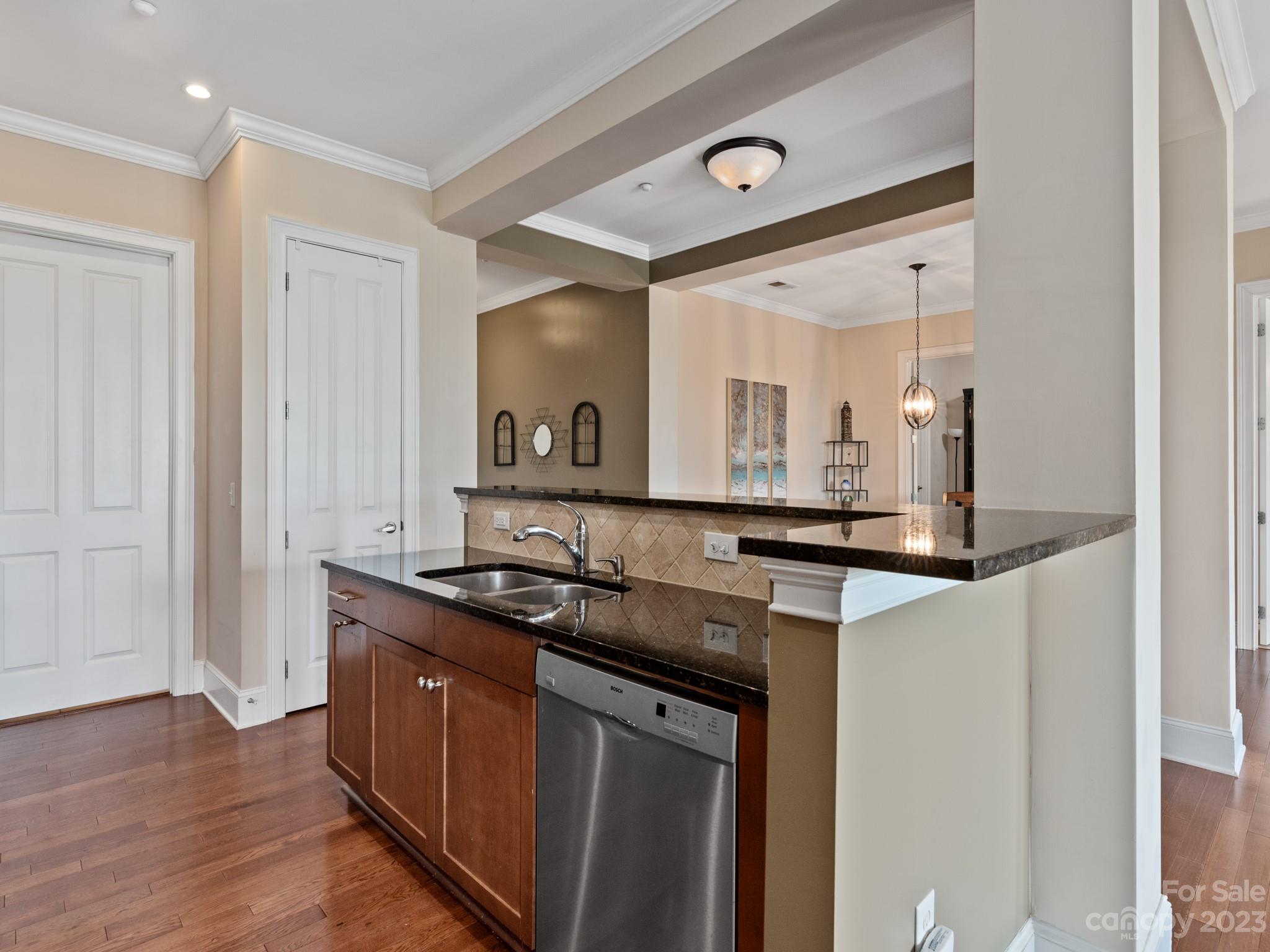 5425 Closeburn Road, Unit 201 Charlotte, NC 28210 - Photo 7 of 35 a kitchen with granite countertop a sink and cabinets