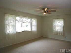4709 Forestdale Road Raleigh, NC 27603 - Photo 2 of 10 a view of an empty room with a window