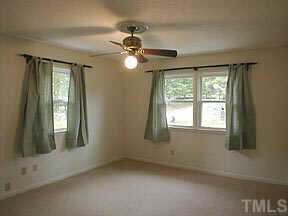 4709 Forestdale Road Raleigh, NC 27603 - Photo 8 of 10 a view of an empty room with a window