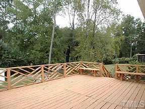 4709 Forestdale Road Raleigh, NC 27603 - Photo 9 of 10 a view of a wooden floor with a yard