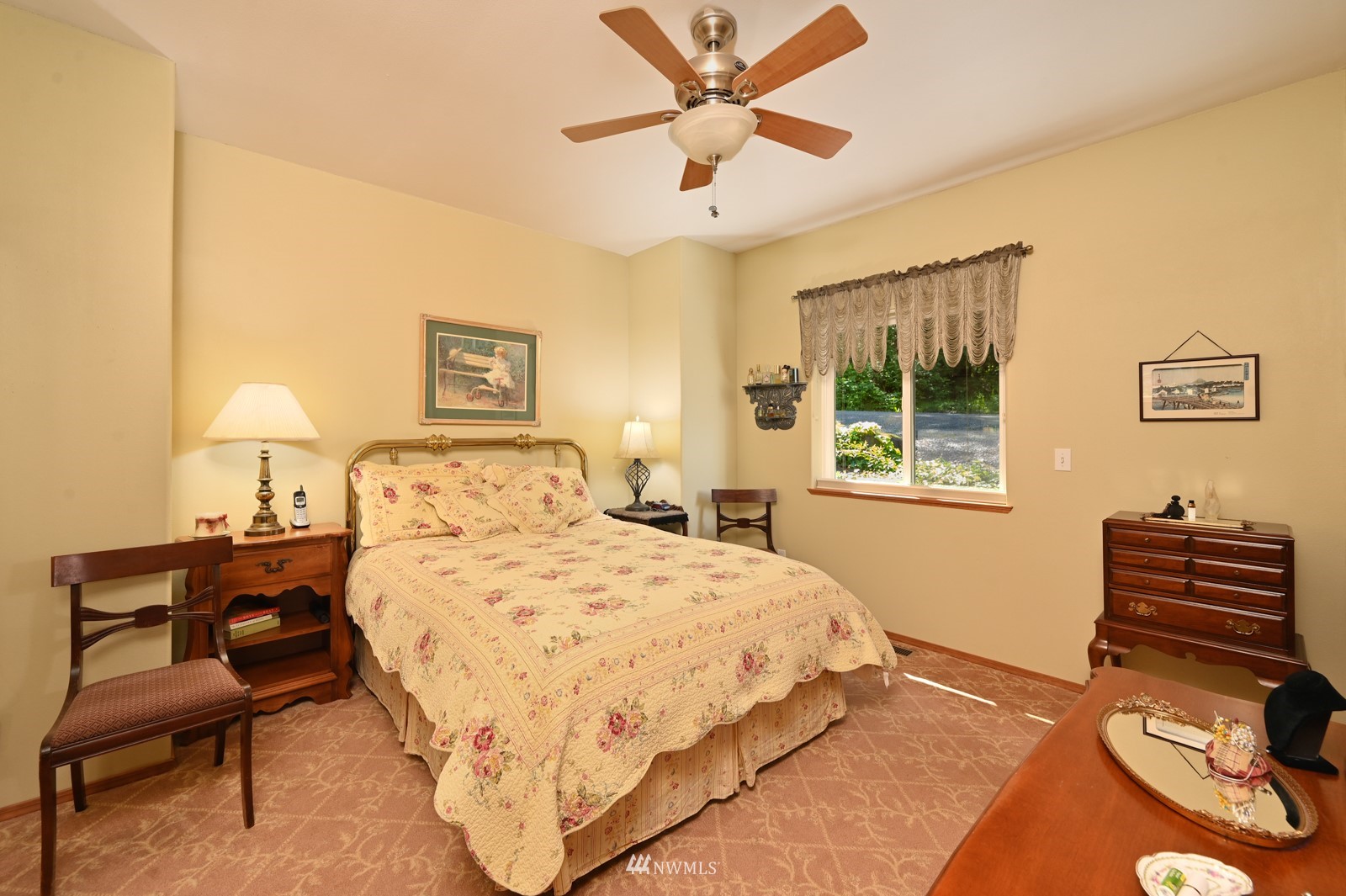 52133 South Riverside Road Gold Bar, WA 98251 - Photo 17 of 40 a bedroom with a bed and a table with chair
