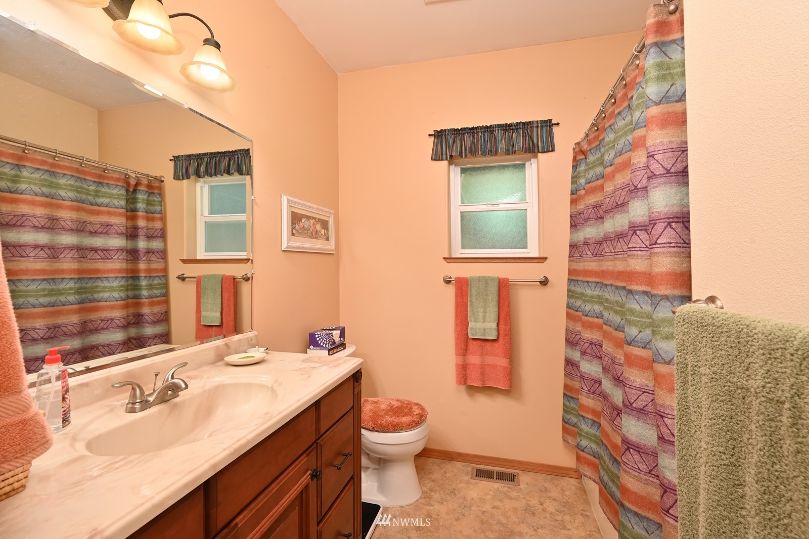 52133 South Riverside Road Gold Bar, WA 98251 - Photo 21 of 40 a bathroom with a granite countertop sink toilet a mirror and shower curtain