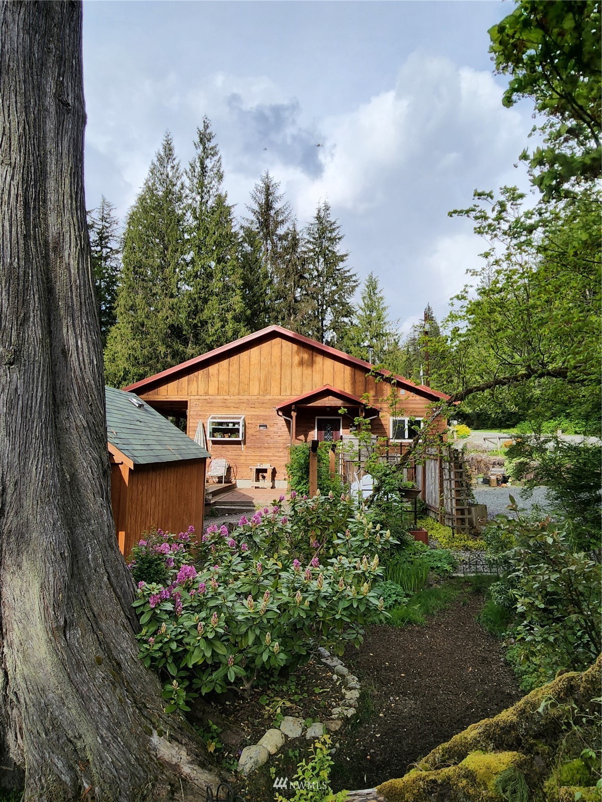 52133 South Riverside Road Gold Bar, WA 98251 - Photo 26 of 40 a view of a house with a yard and plants