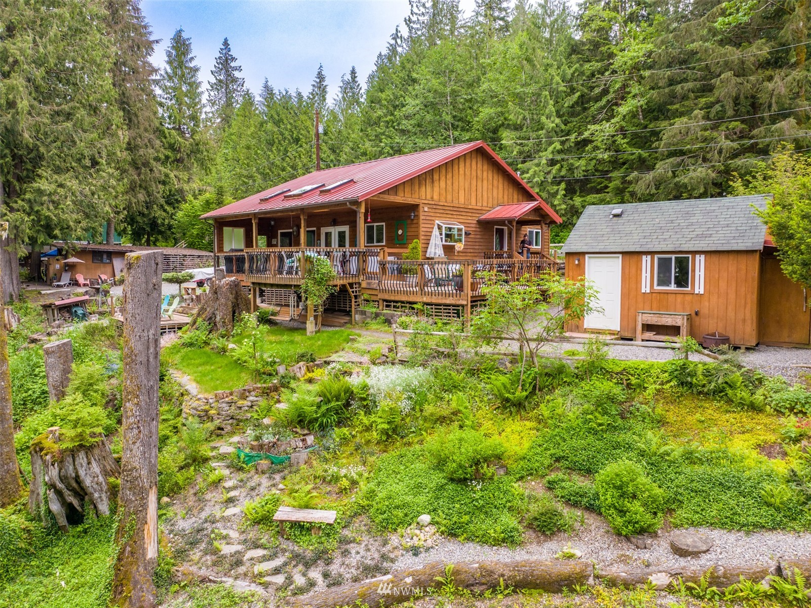 52133 South Riverside Road Gold Bar, WA 98251 - Photo 37 of 40 a backyard of a house with yard and outdoor seating