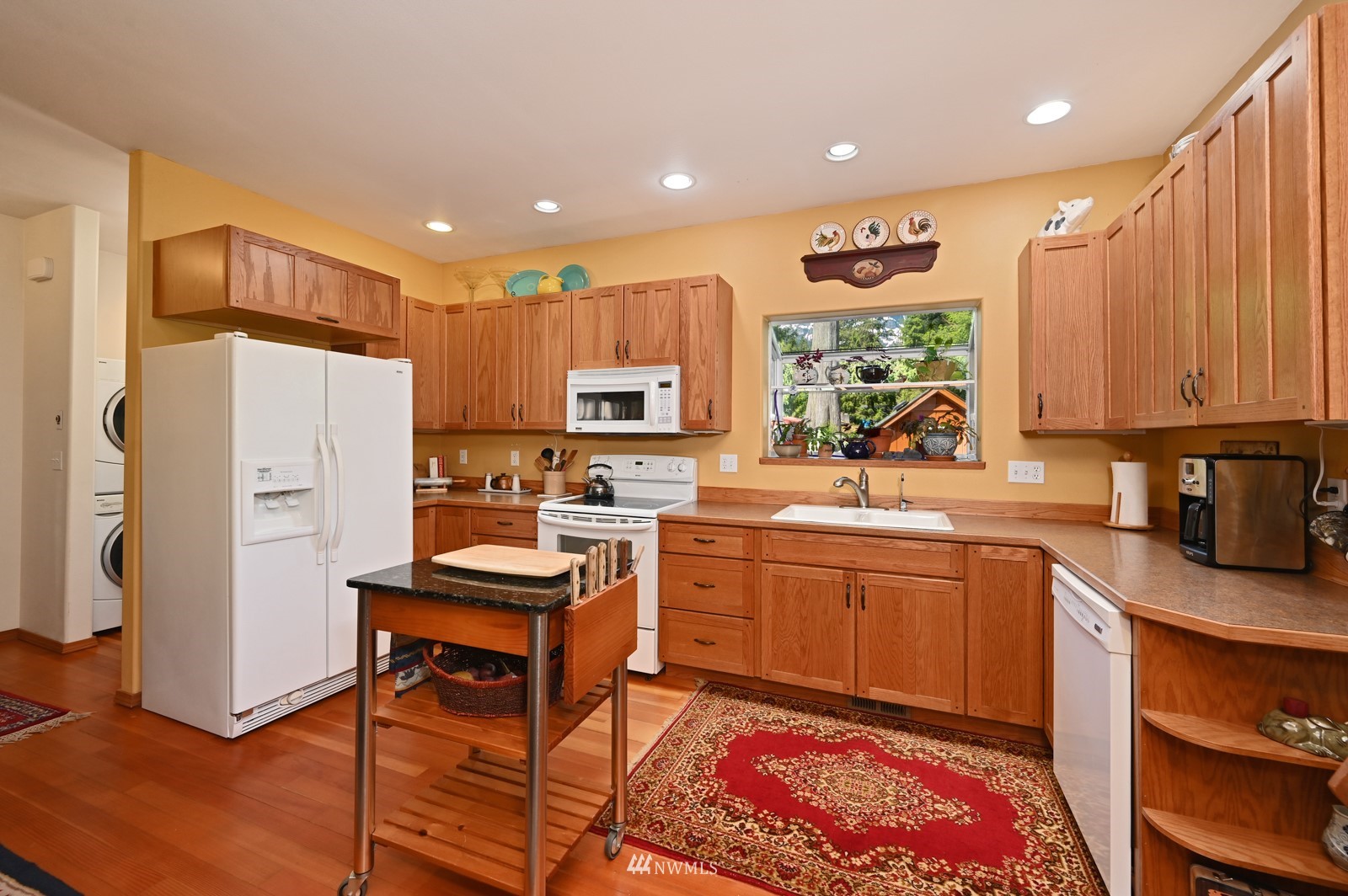 52133 South Riverside Road Gold Bar, WA 98251 - Photo 7 of 40 a kitchen with a sink appliances and cabinets
