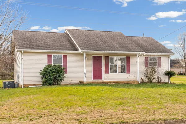 a front view of house with yard and porch