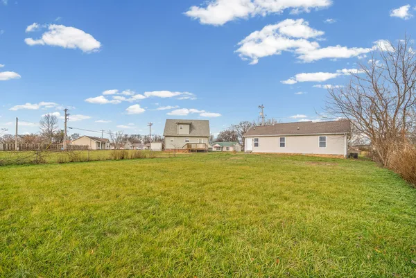 a view of a house with a big yard