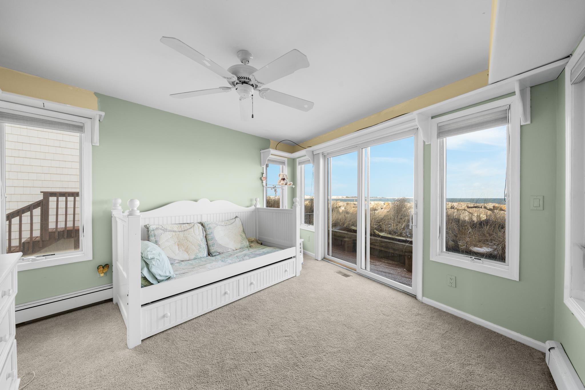 283 6th Street Avalon, NJ 08202 - Photo 21 of 36 a living room with furniture and a large window