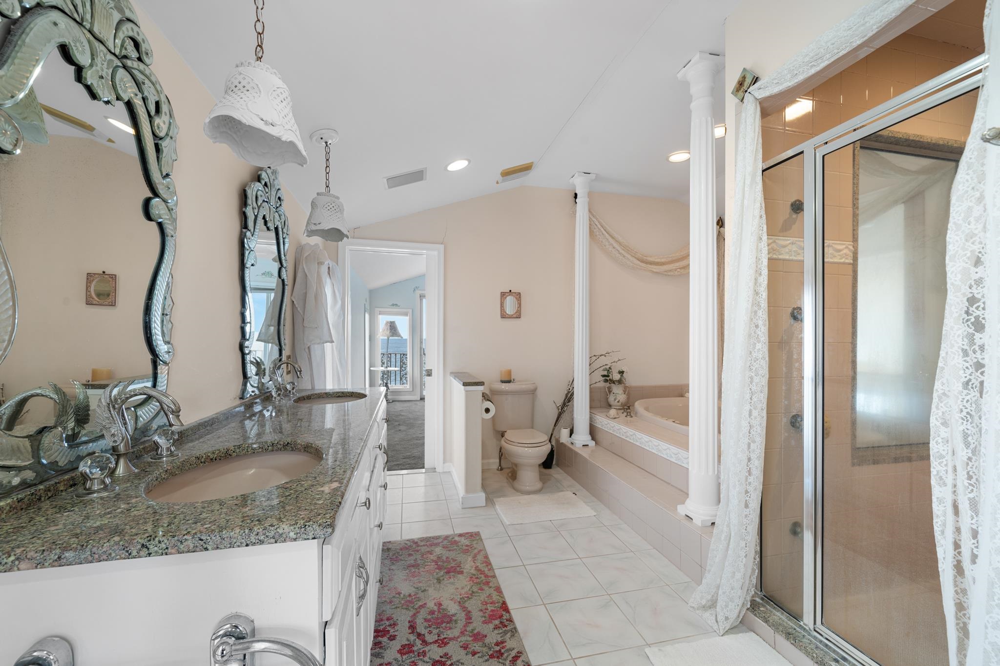 283 6th Street Avalon, NJ 08202 - Photo 32 of 36 a bathroom with a granite countertop sink mirror and a shower