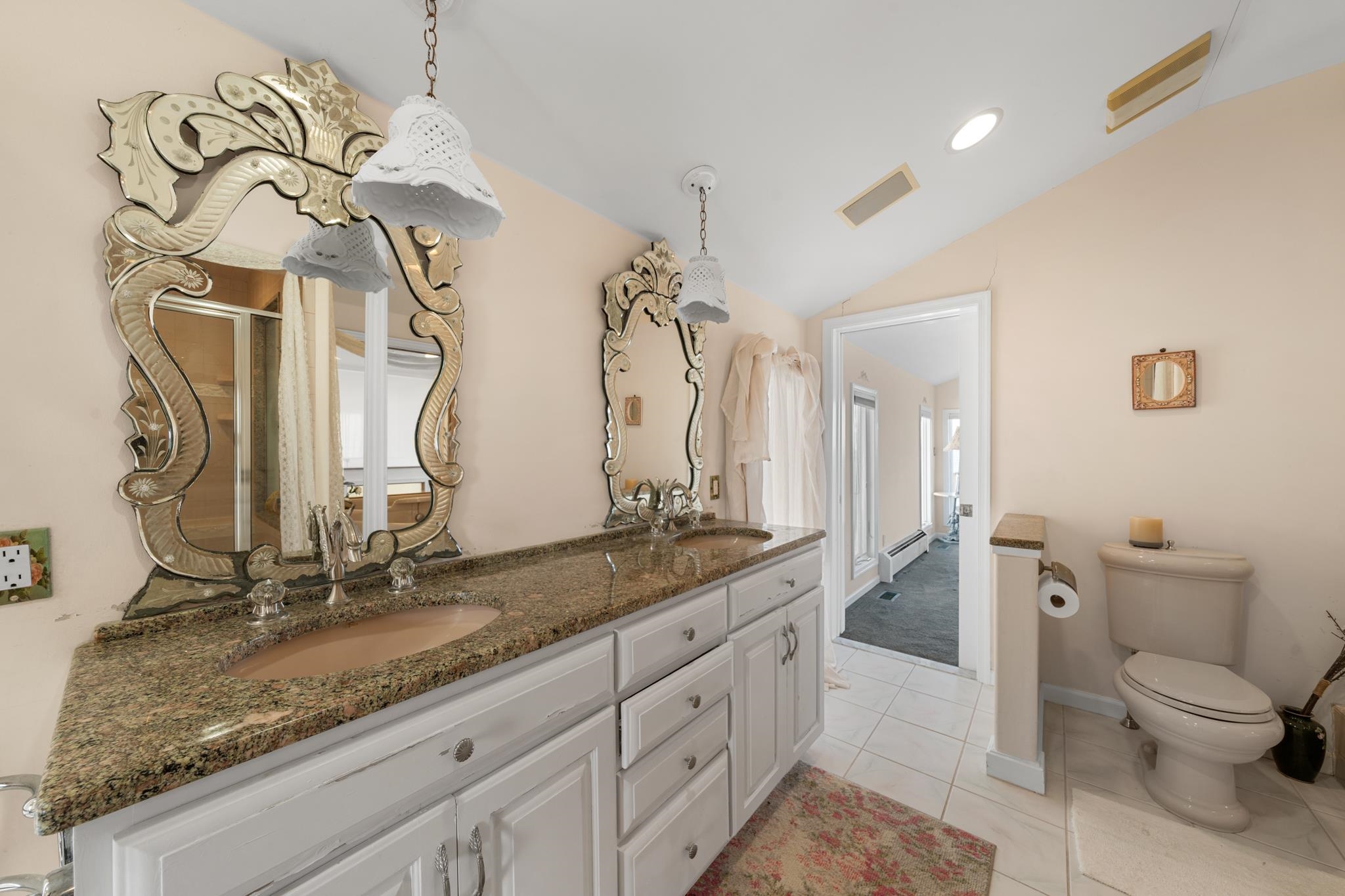283 6th Street Avalon, NJ 08202 - Photo 33 of 36 a bathroom with a granite countertop sink a toilet and a mirror