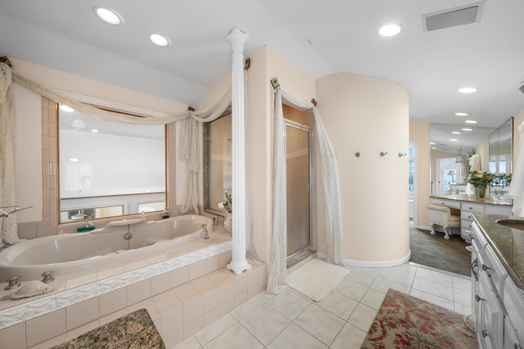 283 6th Street Avalon, NJ 08202 - Photo 34 of 36 a spacious bathroom with a tub sink and mirror