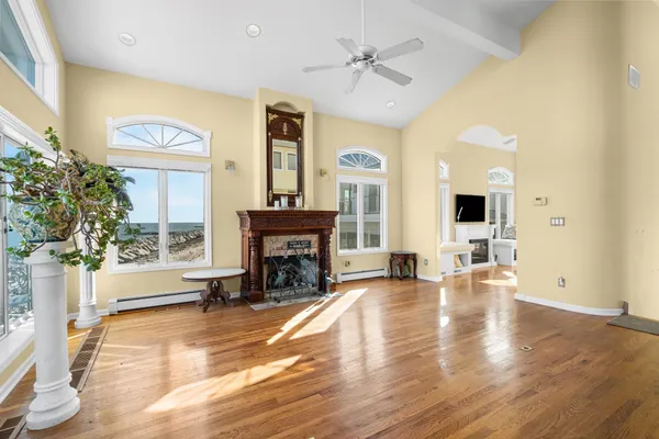 a view of a livingroom with furniture and a fireplace