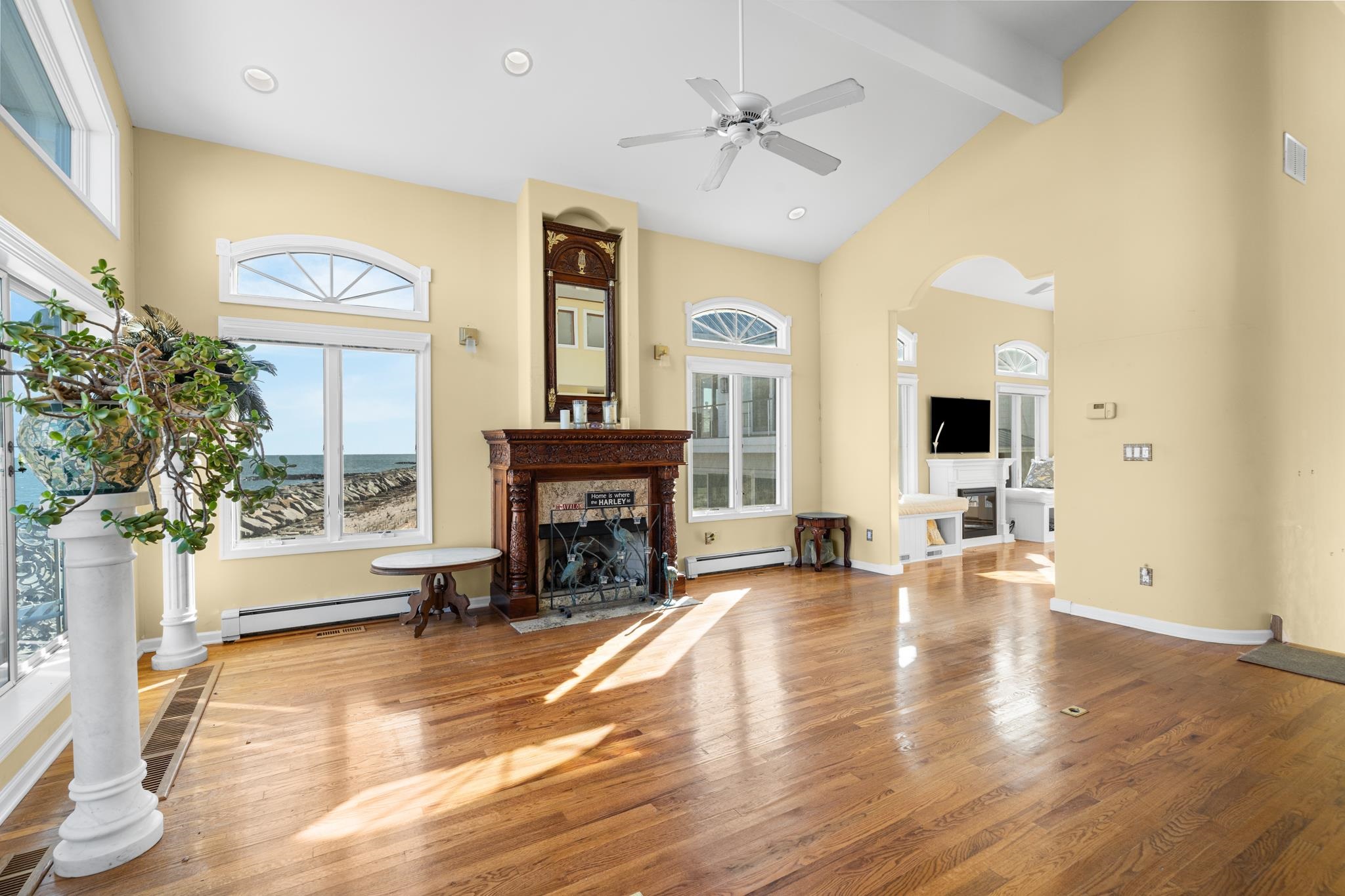 283 6th Street Avalon, NJ 08202 - Photo 8 of 36 a view of an empty room with a fireplace and a window