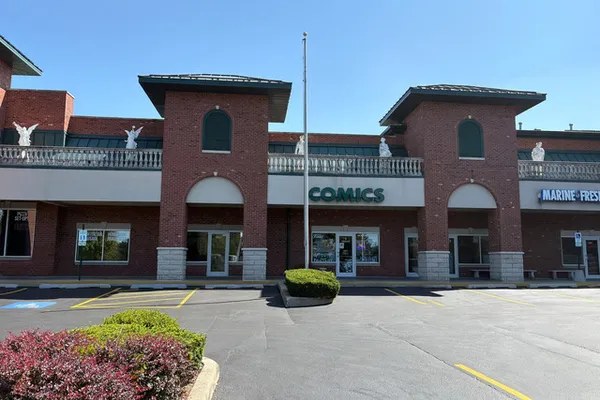 a front view of a house with swimming pool having outdoor seating