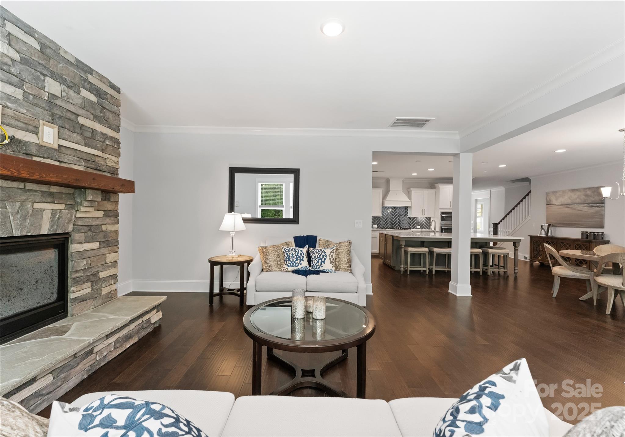 3239 Split Rail Lane Lancaster, SC 29720 - Photo 13 of 39 a living room with furniture a fireplace and a table