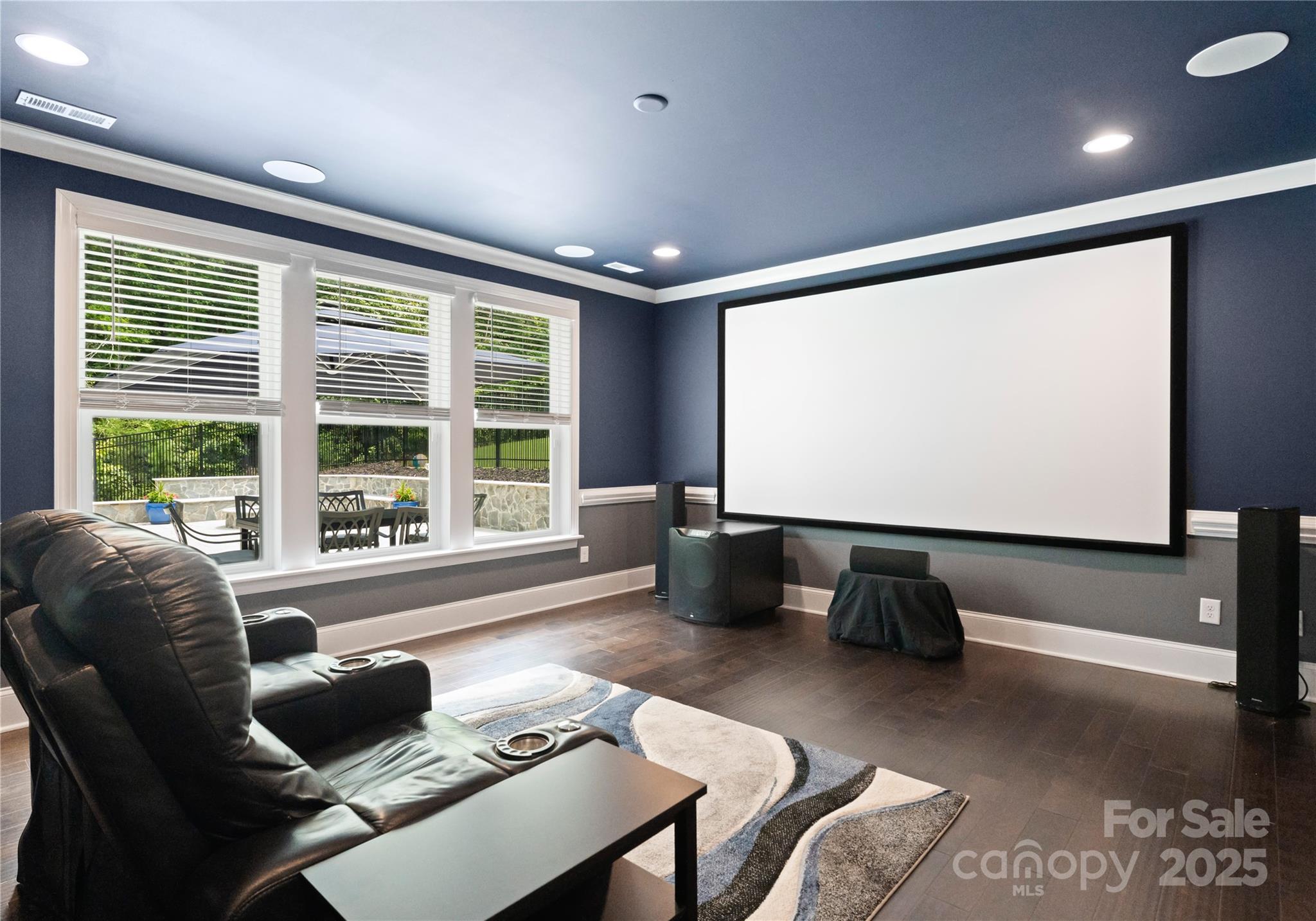 3239 Split Rail Lane Lancaster, SC 29720 - Photo 23 of 39 a living room with furniture a projector and a large window