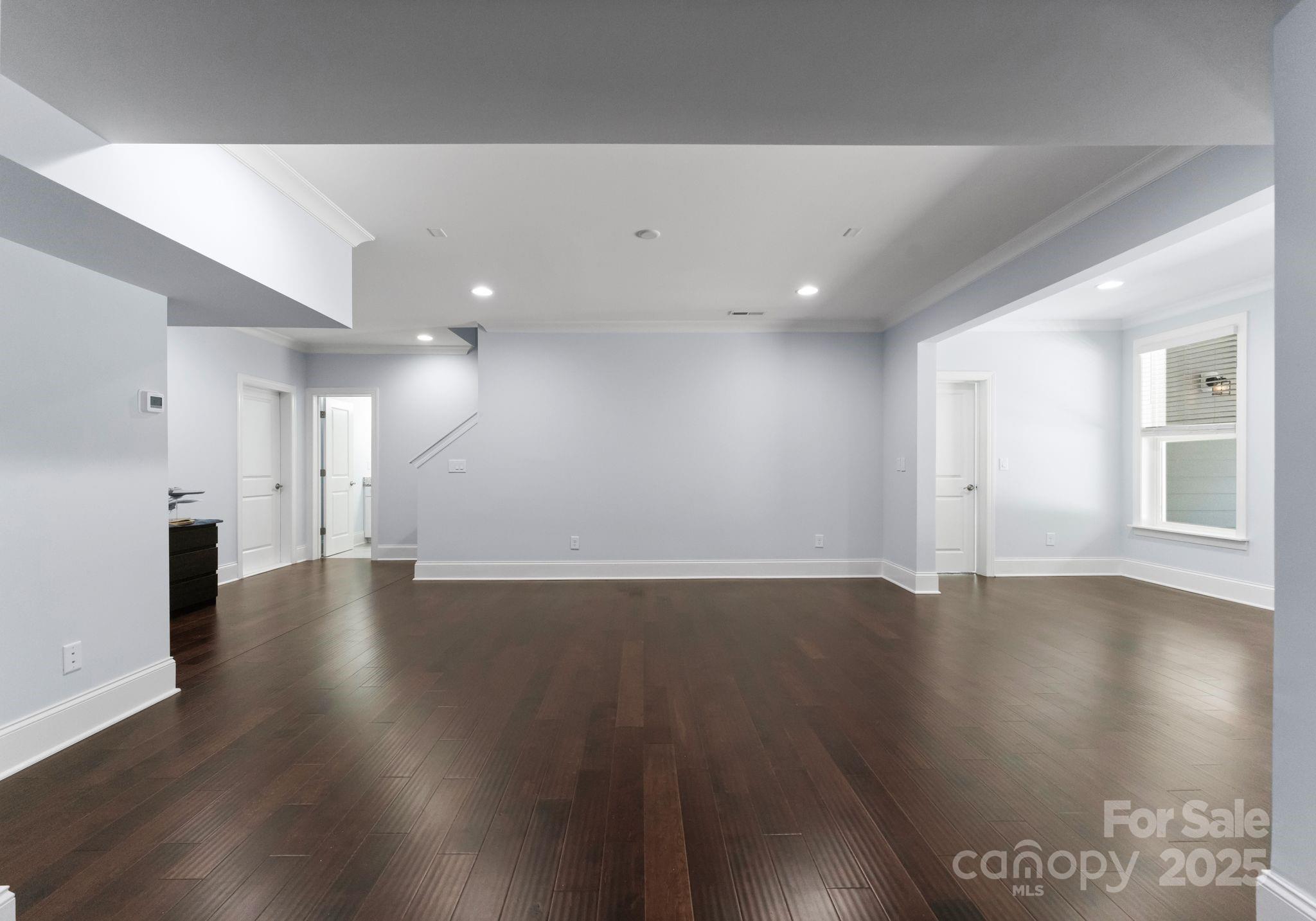 3239 Split Rail Lane Lancaster, SC 29720 - Photo 28 of 39 a view of an empty room with wooden floor and a window