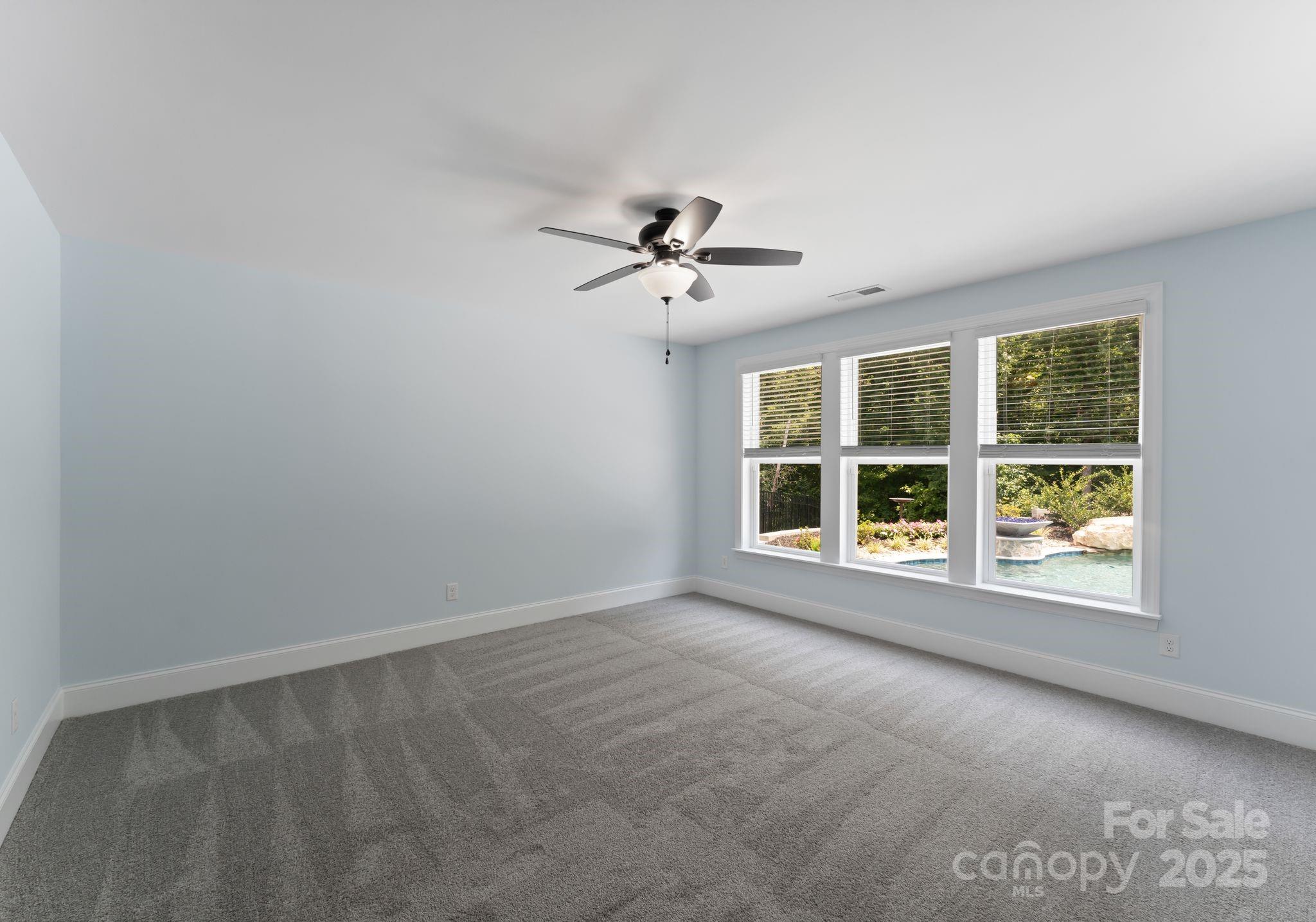 3239 Split Rail Lane Lancaster, SC 29720 - Photo 32 of 39 an empty room with a window and a ceiling fan