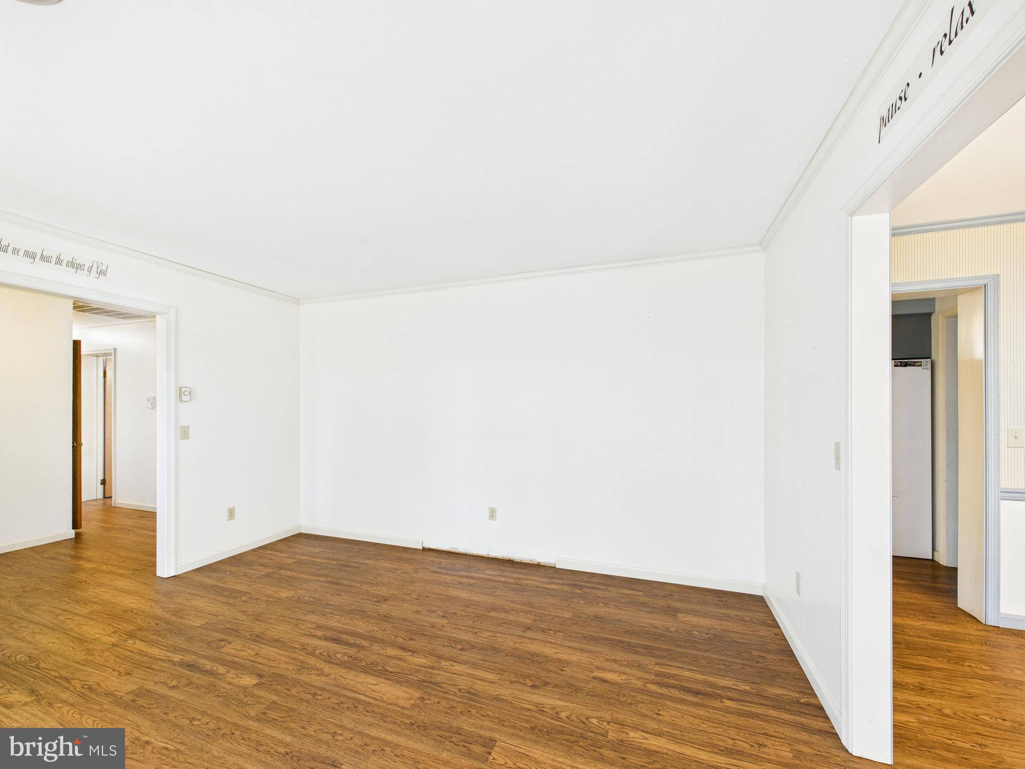 5046 Manokin Road Crisfield, MD 21817 - Photo 15 of 72 a view of empty room with wooden floor