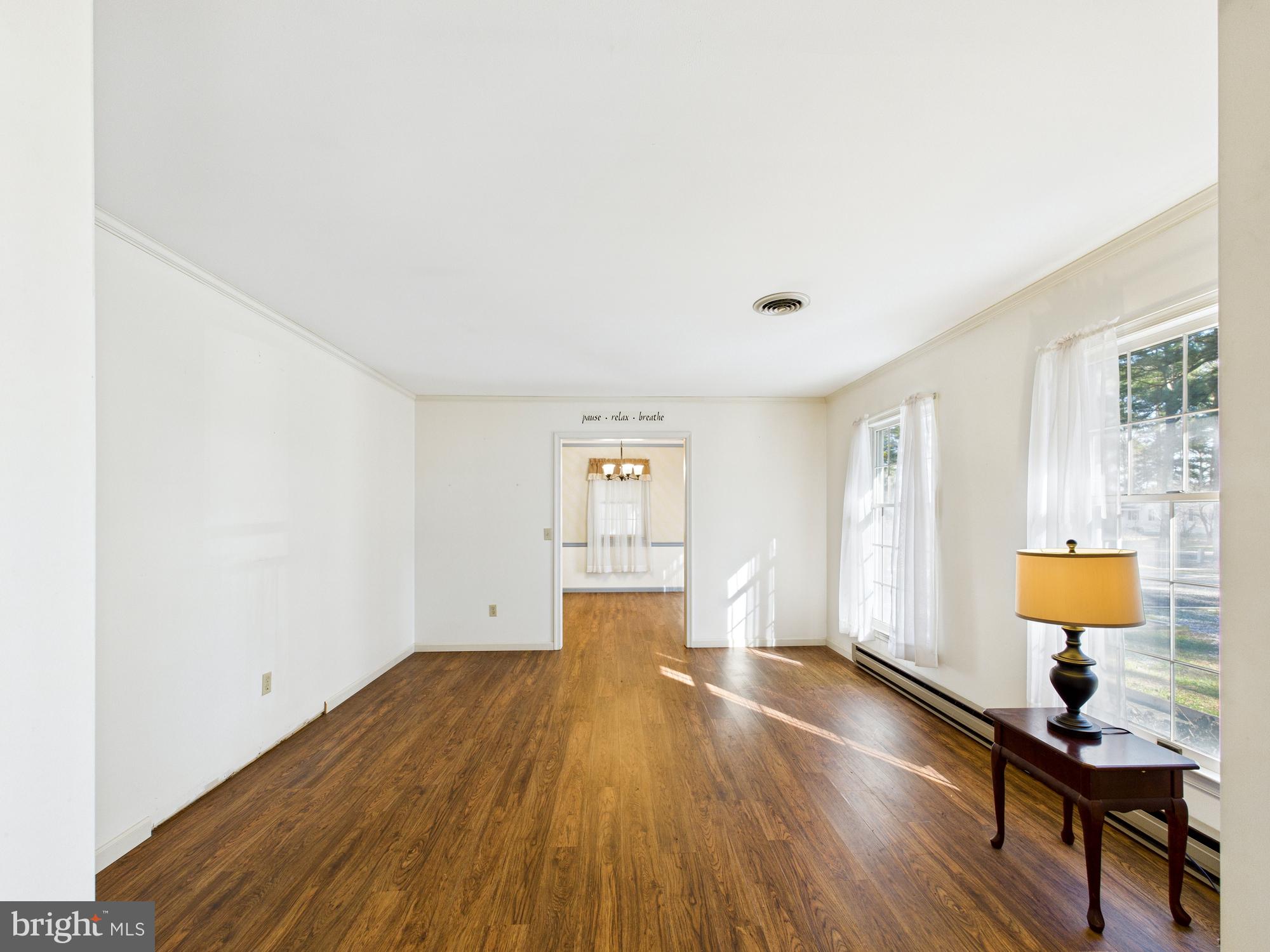 5046 Manokin Road Crisfield, MD 21817 - Photo 16 of 72 a view of empty room with wooden floor