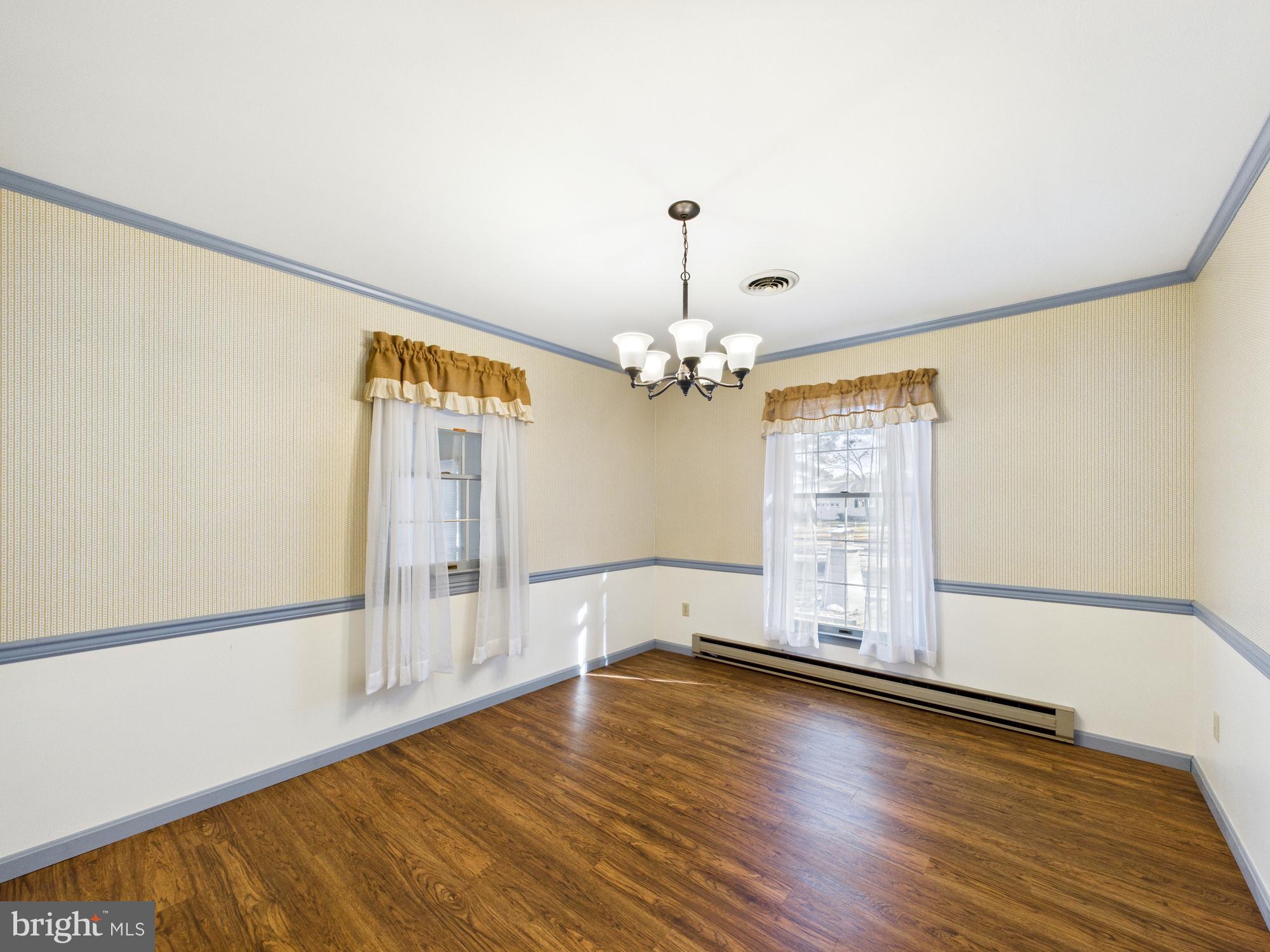 5046 Manokin Road Crisfield, MD 21817 - Photo 19 of 72 a view of a livingroom with wooden floor