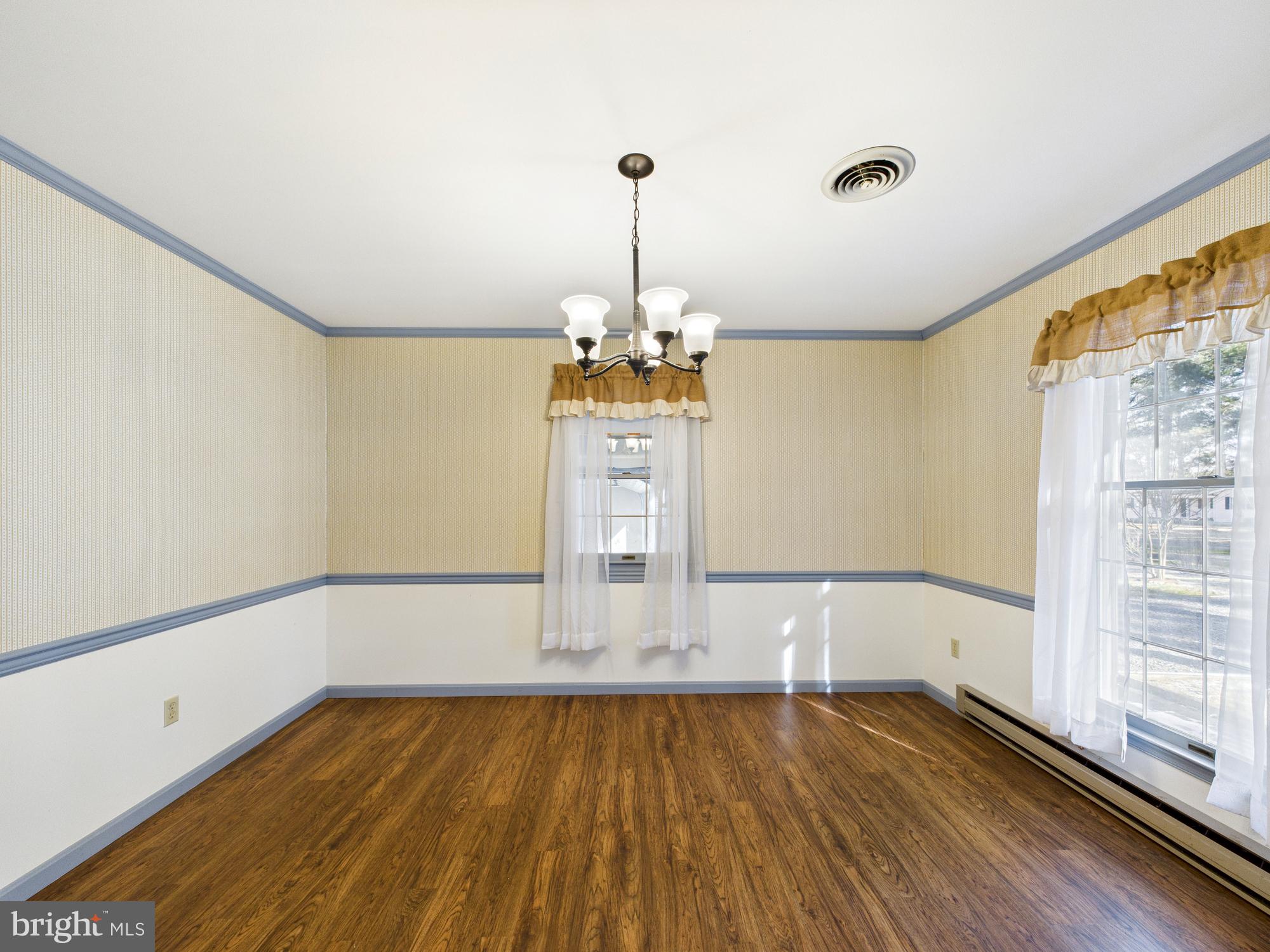 5046 Manokin Road Crisfield, MD 21817 - Photo 20 of 72 a view of wooden floor and windows in a room
