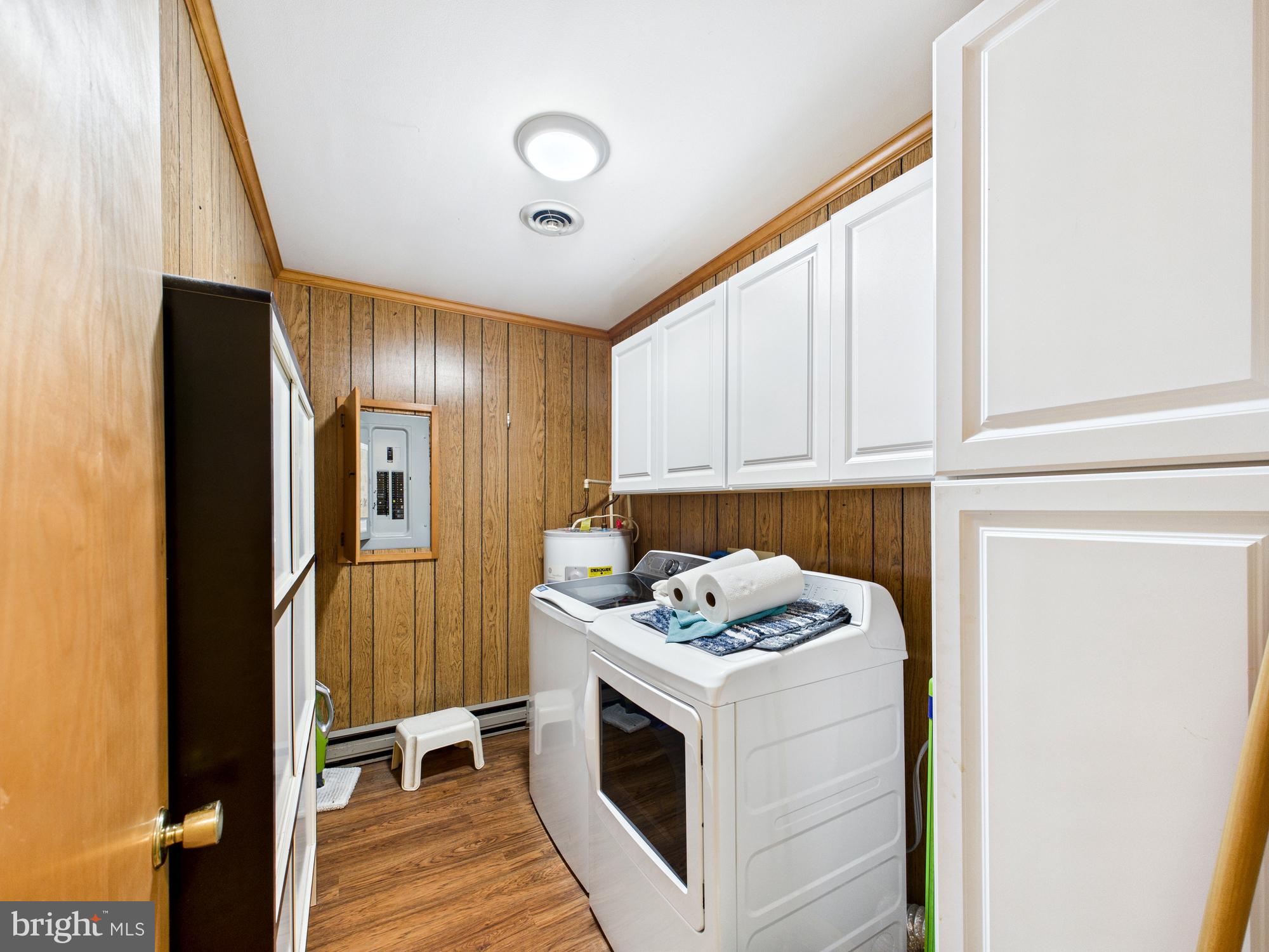 5046 Manokin Road Crisfield, MD 21817 - Photo 38 of 72 a kitchen with a stove and a refrigerator