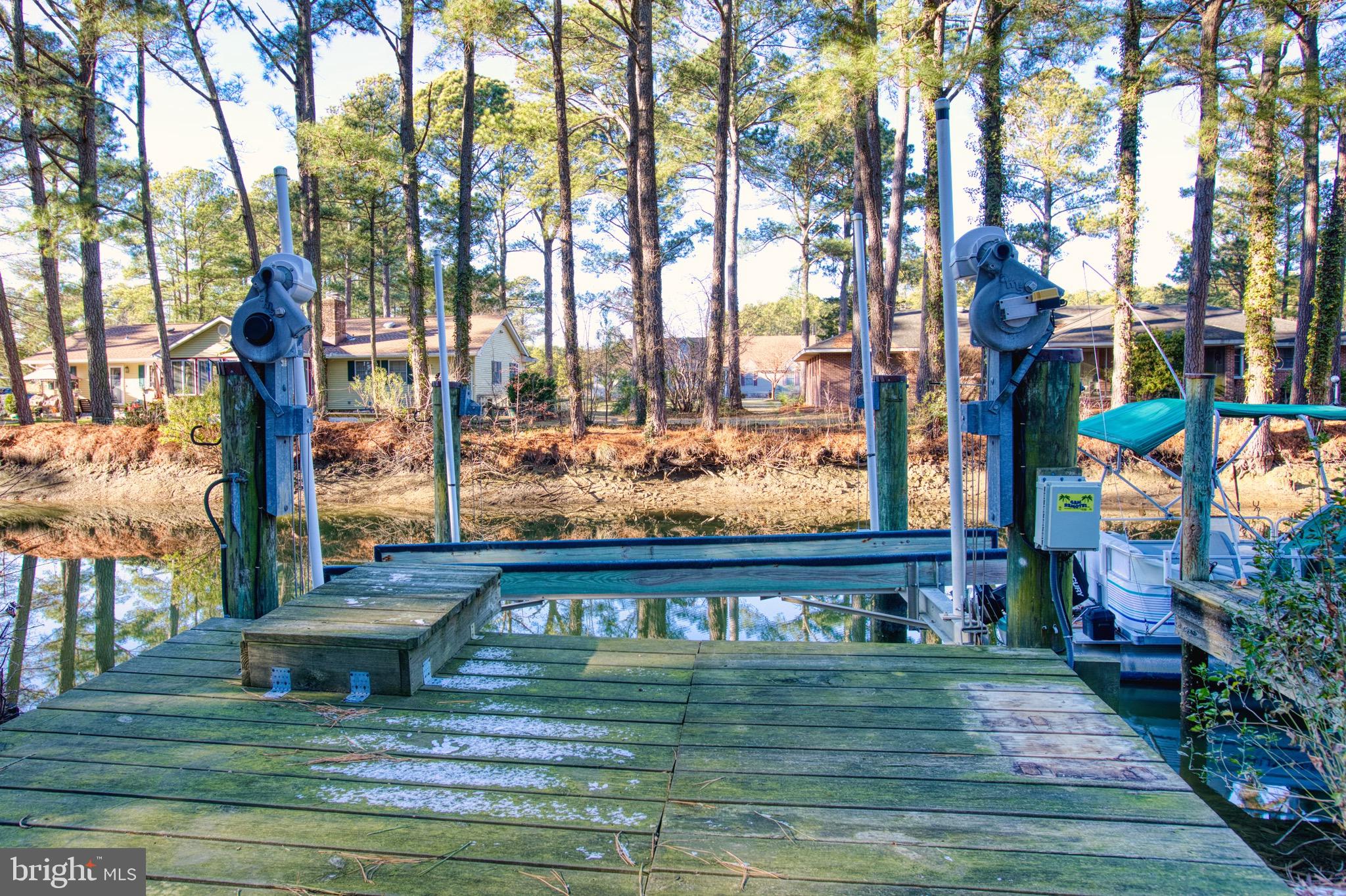 5046 Manokin Road Crisfield, MD 21817 - Photo 53 of 72 a front view of a house with a yard