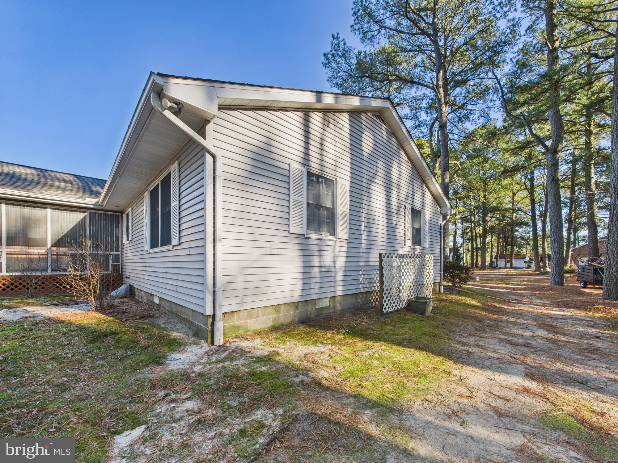 5046 Manokin Road Crisfield, MD 21817 - Photo 67 of 72 a view of a house with a yard