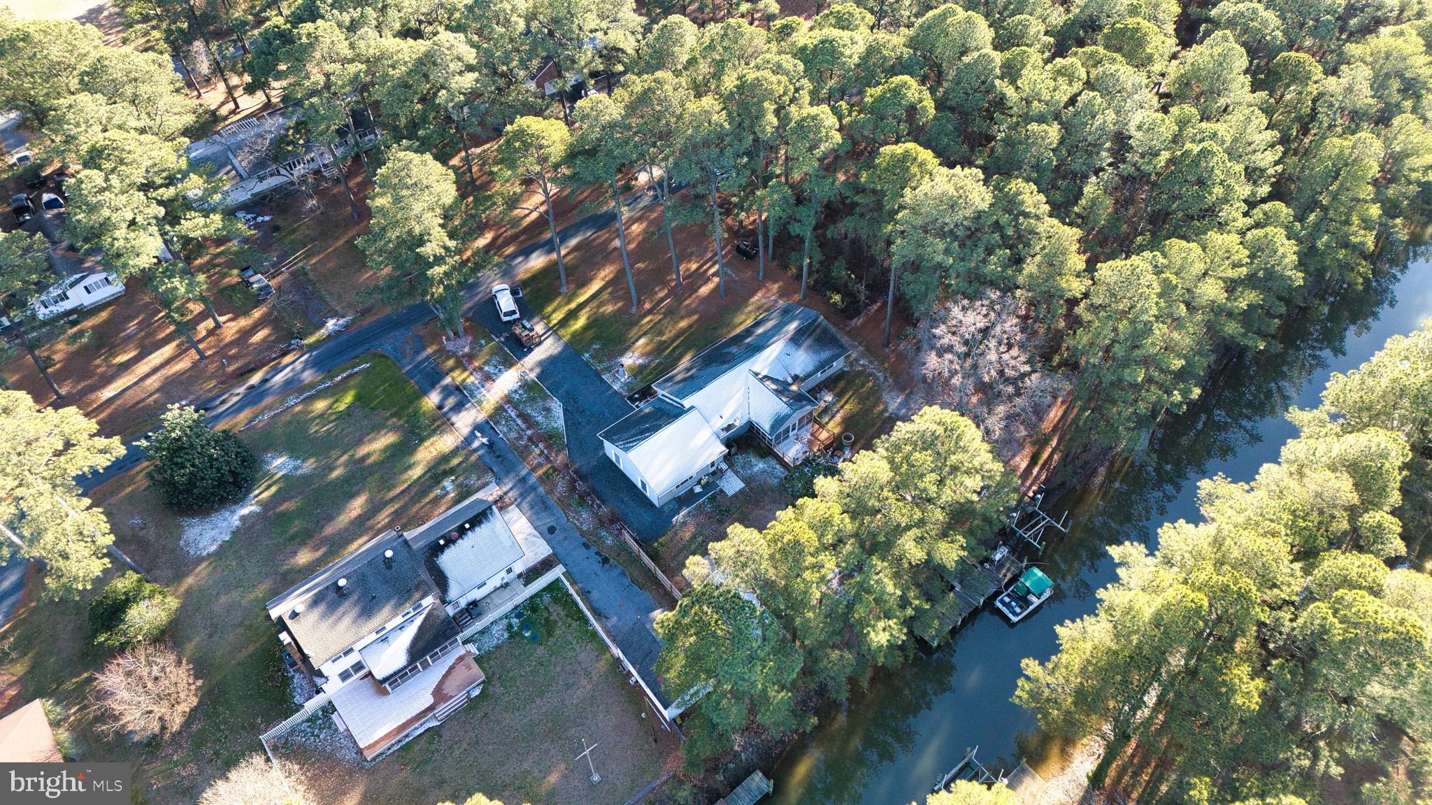 5046 Manokin Road Crisfield, MD 21817 - Photo 72 of 72 a backyard of a house with lots of green space