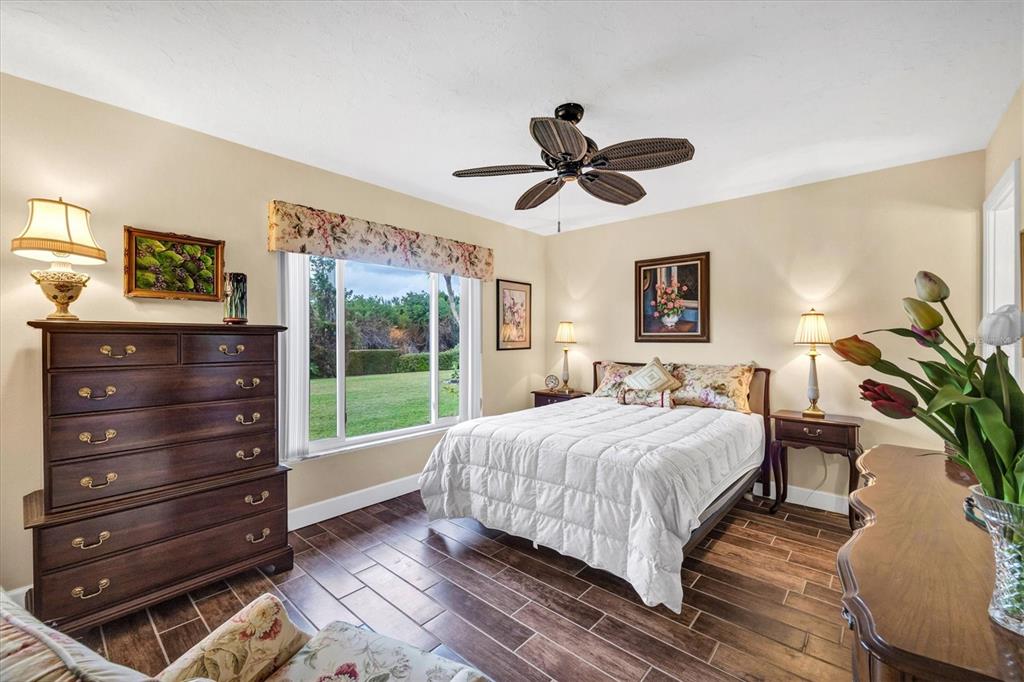 6416 Mercer Road Bradenton, FL 34207 - Photo 15 of 38 a bedroom with a large bed and a window