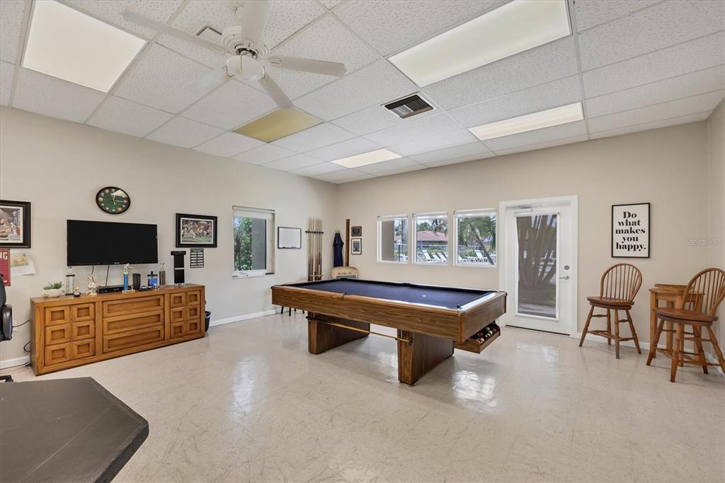 6416 Mercer Road Bradenton, FL 34207 - Photo 36 of 38 a living room with furniture pool table and flat screen tv
