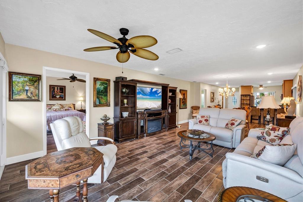 6416 Mercer Road Bradenton, FL 34207 - Photo 5 of 38 a living room with furniture a ceiling fan and a rug
