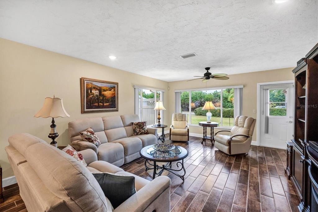 6416 Mercer Road Bradenton, FL 34207 - Photo 6 of 38 a living room with furniture and a large window