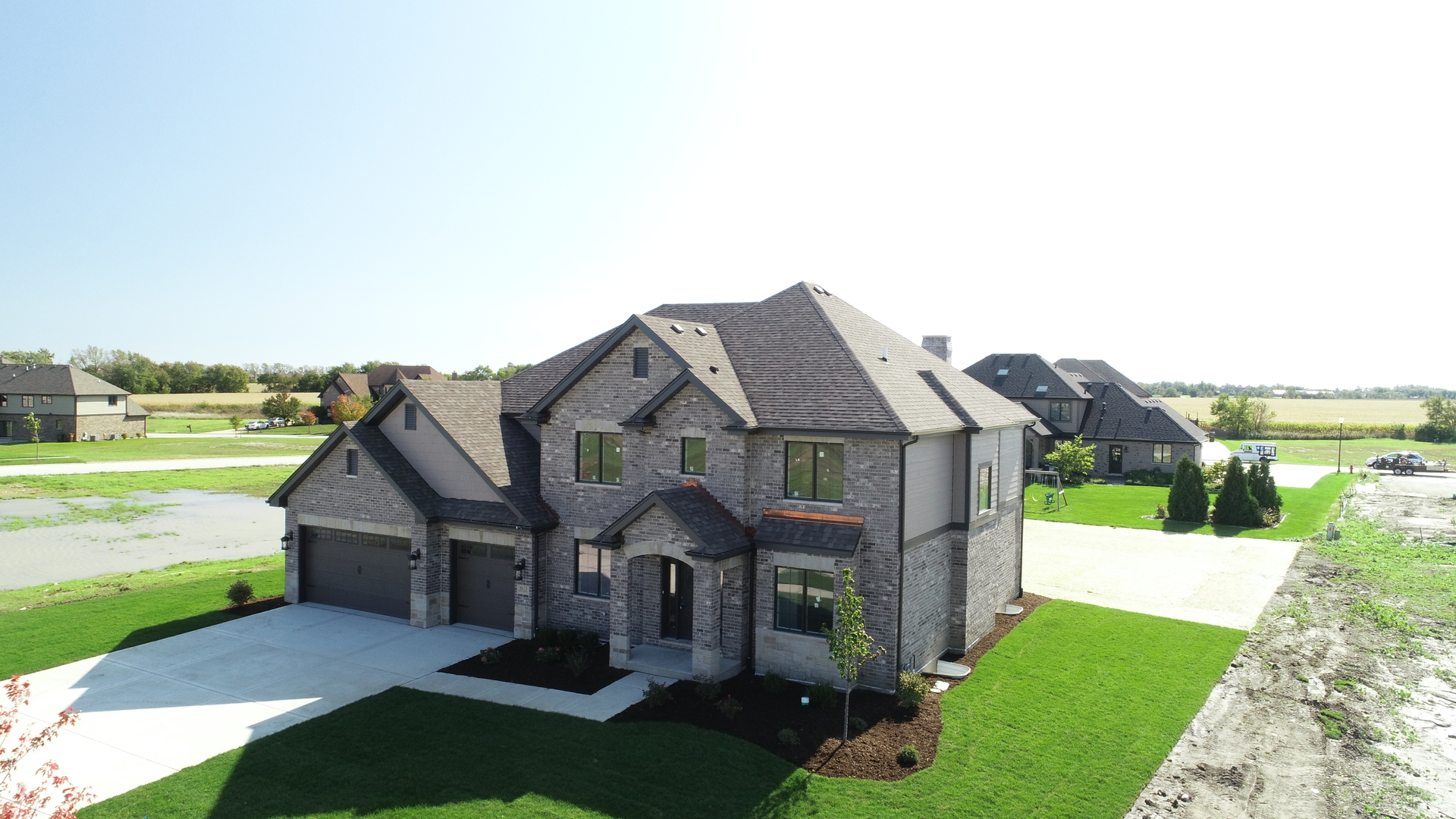 8613 High Stone Way Frankfort, IL 60423 - Photo 2 of 31 a front view of a house with a yard and mountain view