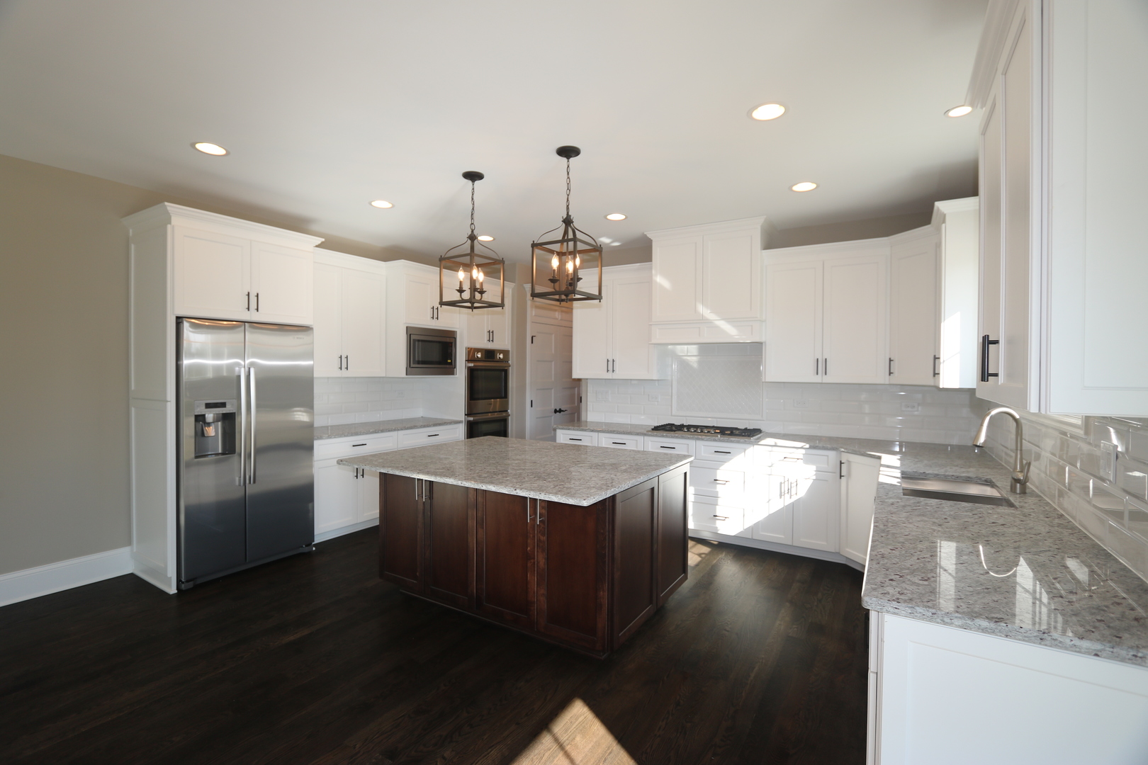 8613 High Stone Way Frankfort, IL 60423 - Photo 11 of 31 a kitchen with stainless steel appliances granite countertop a sink a stove and a refrigerator