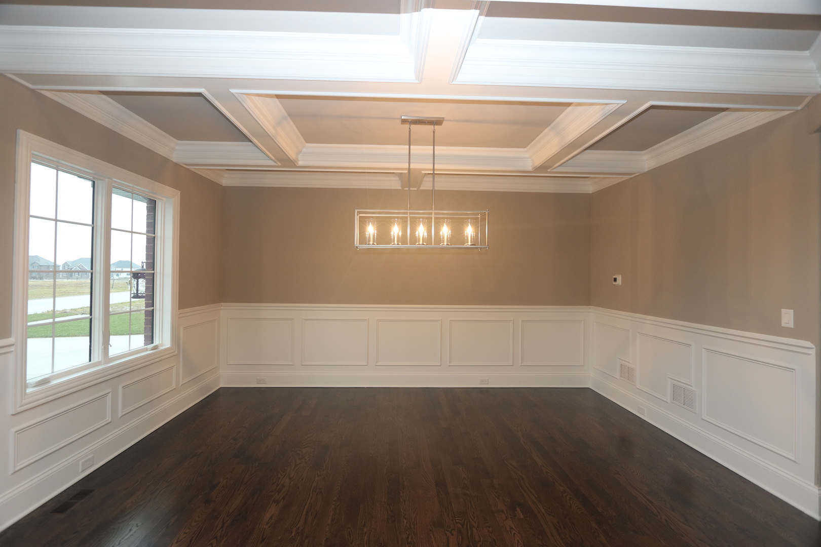 8613 High Stone Way Frankfort, IL 60423 - Photo 12 of 31 en empty room with wooden floor and windows