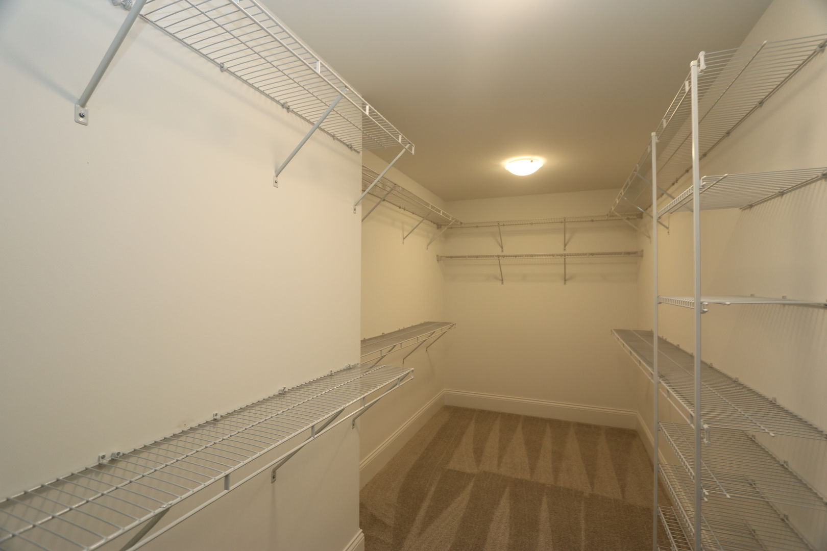 8613 High Stone Way Frankfort, IL 60423 - Photo 21 of 31 a view of a room with racks on the wall