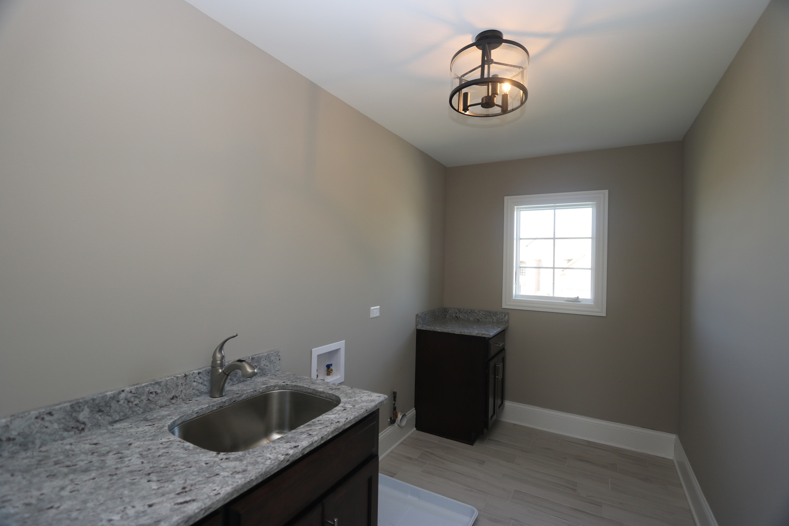 8613 High Stone Way Frankfort, IL 60423 - Photo 22 of 31 a kitchen with a sink and cabinets